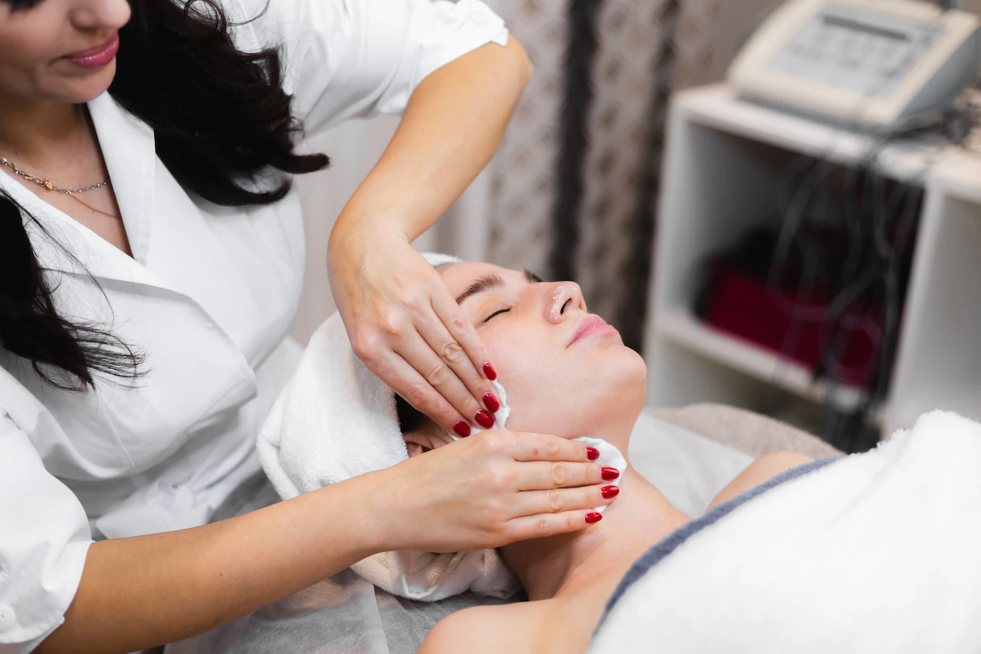 woman client salon receiving manual facial massage from beautician 343596 4306
