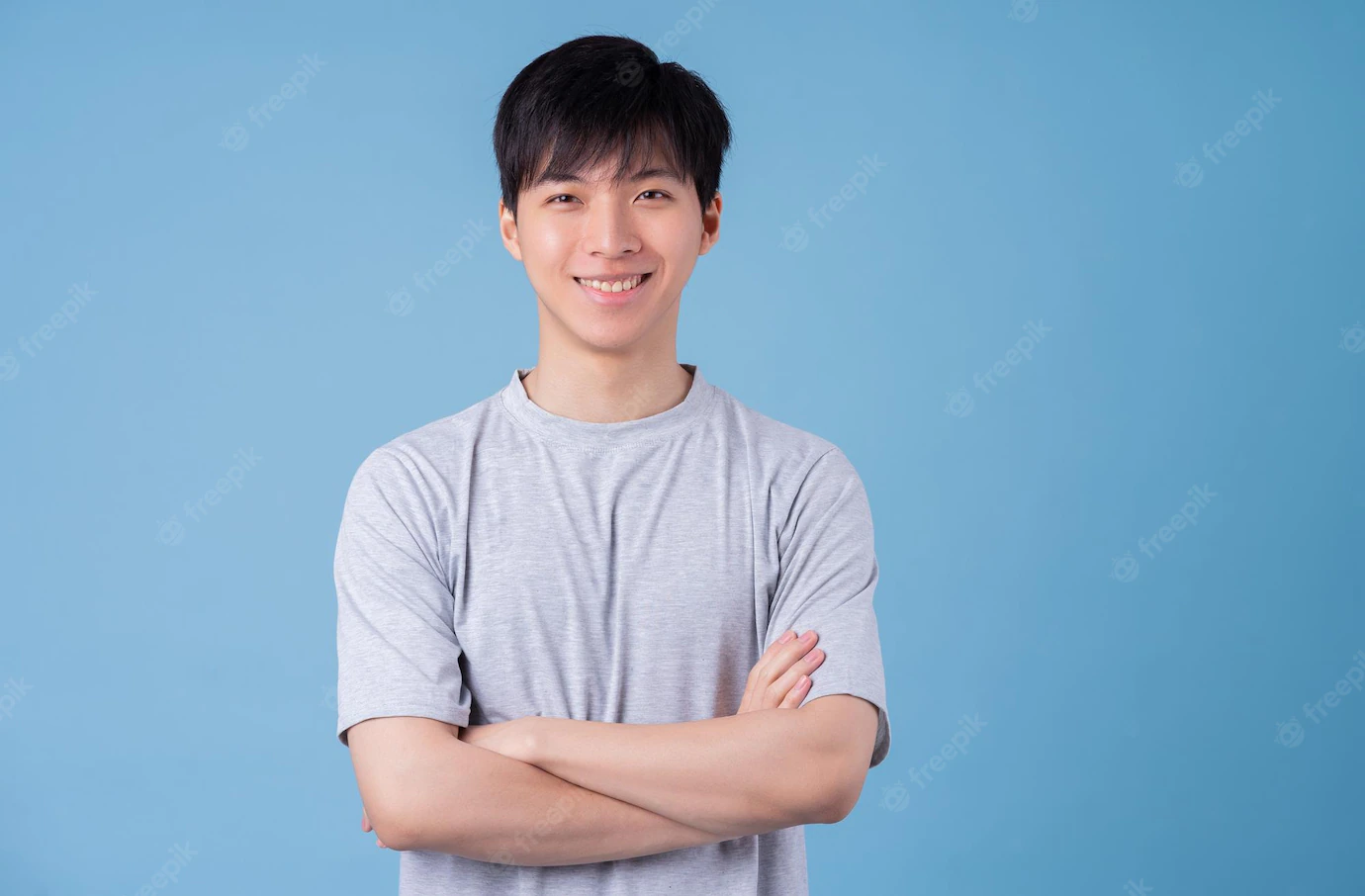 young asian man posing blue background 296537 4369